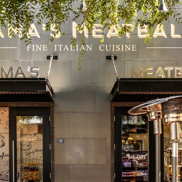 Mama's Meatball restaurant exterior with "Fine Italian Cuisine" signage and open doors.